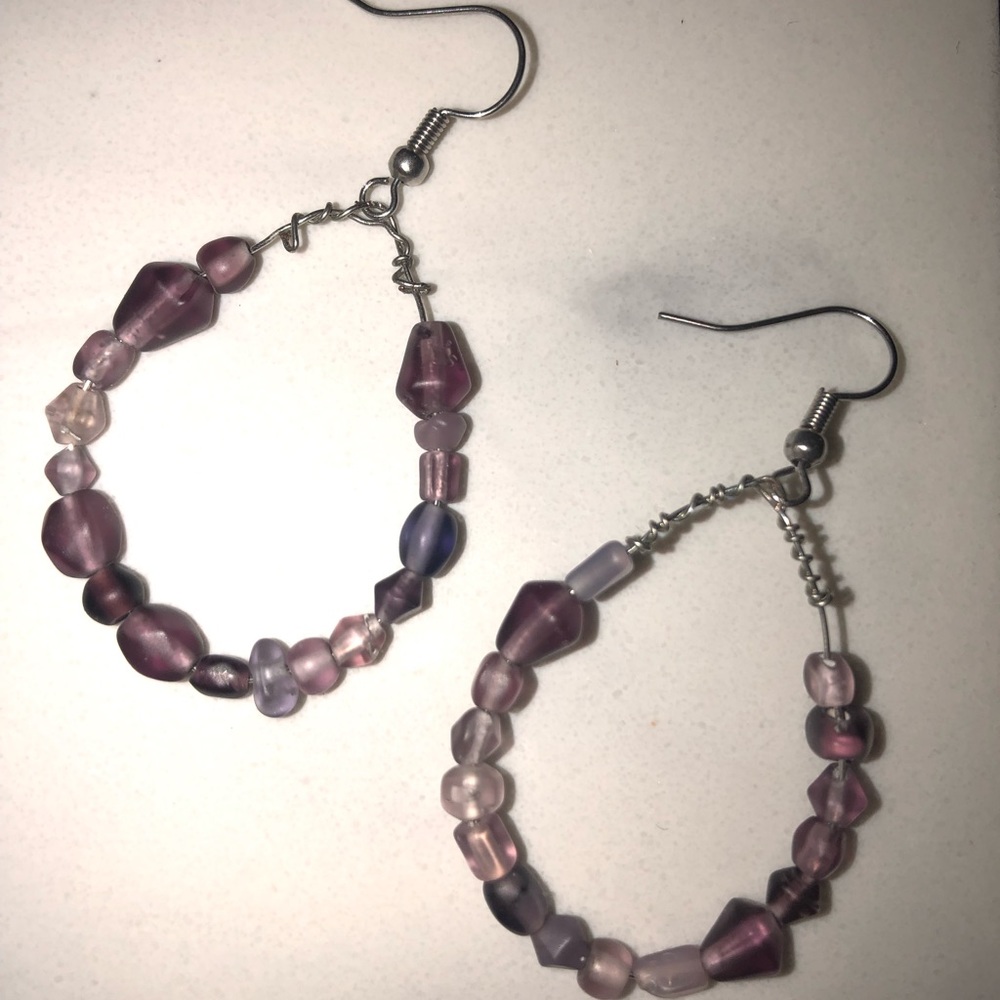 Homemade purple beaded hoop earrings